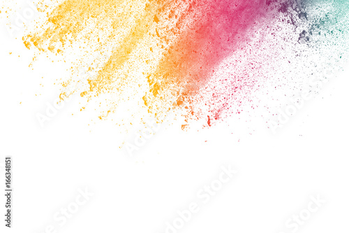 abstract multicolored powder splatted on white background Freeze motion of color powder exploding