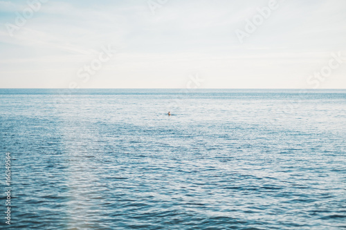 Man swims in the sea.
