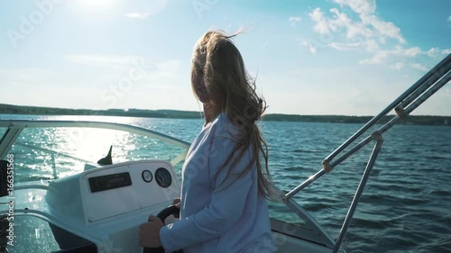 Wallpaper Mural Summer vacation - young girl driving a motor boat Torontodigital.ca
