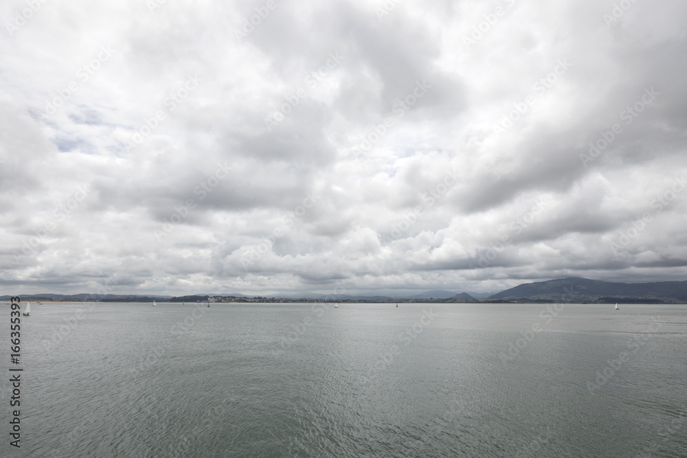 Calm waters in a cloudy day (Santander, Cantabria, Spain). Calm waters in a cloudy day (Santander, Cantabria, Spain).