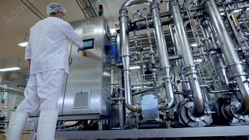 An operator sets work mode for dairy piping. 