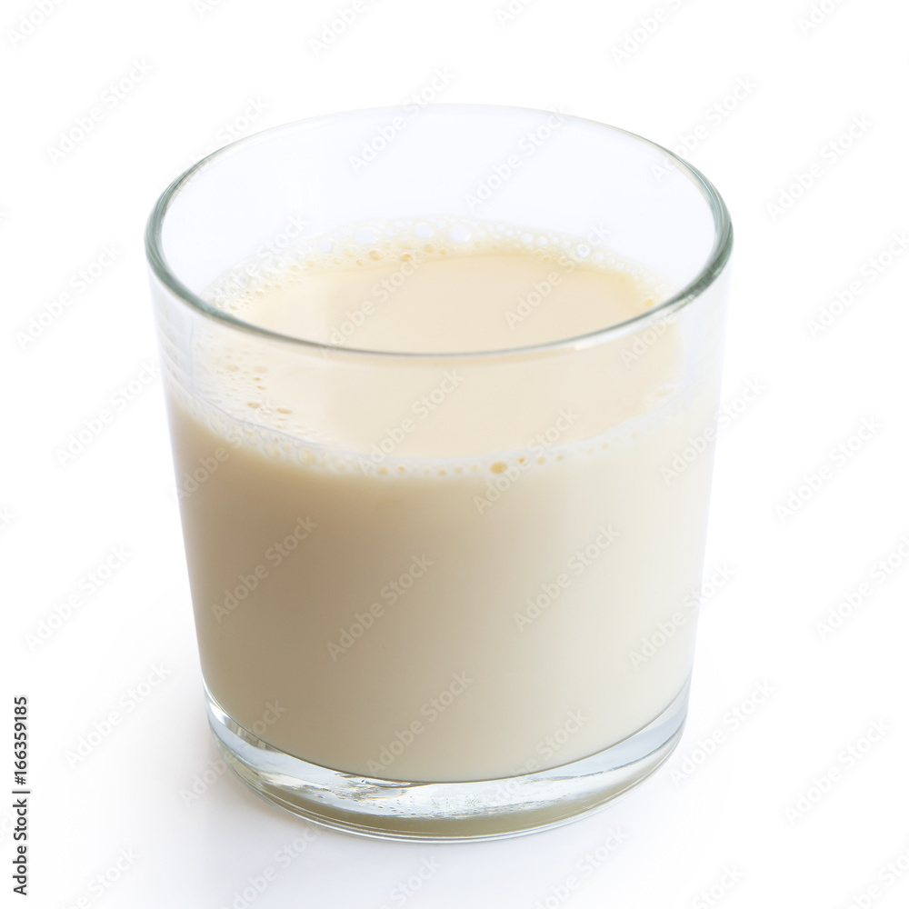 Glass of soya milk with froth isolated on white. Glass of soya milk with froth isolated on white.