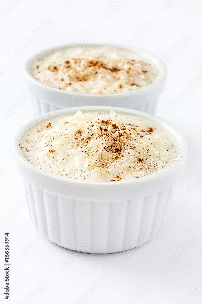 Arroz con leche. Rice pudding with cinnamon isolated on white background
Arroz con leche. Rice pudding with cinnamon isolated on white background
