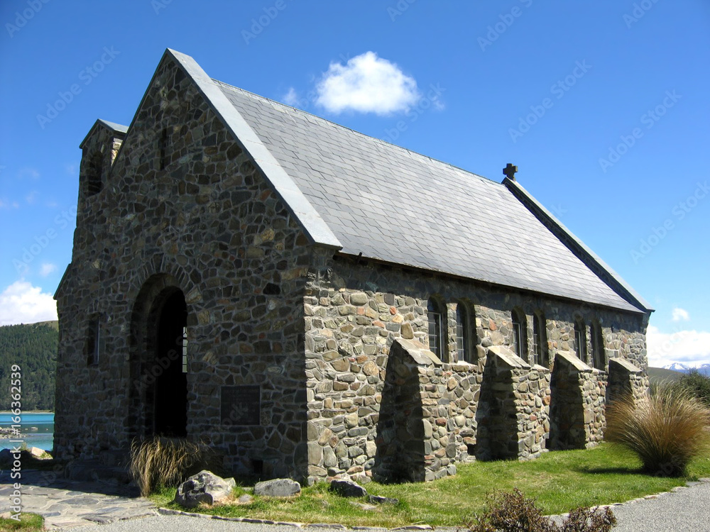 Old Stone Church under a Blue Sky