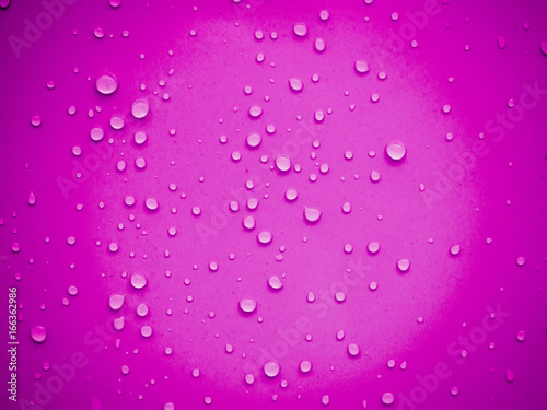 Water drops on pink background