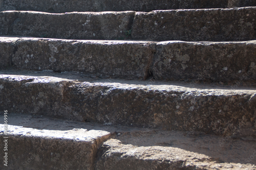 Old stone steps illuminated by the sun. Old stone steps illuminated by the sun.