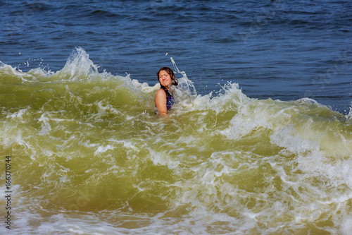 girl bathes in waves © ungvar