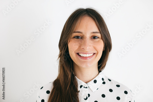 Young beautiful woman portrait over white.