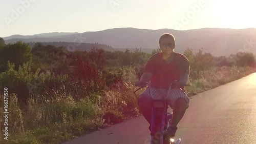 Ride moped at sunset road photo
