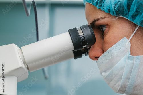 Young Woman Working in an Assisted Reproduction Laboratory photo