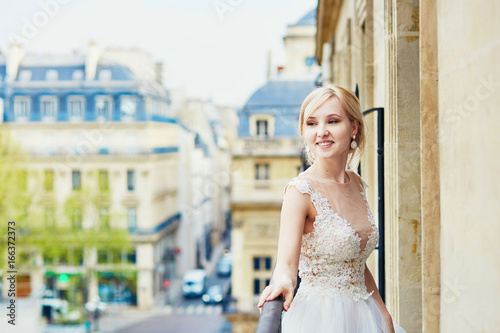 Beautiful young bride on the balcony of her home or hotel room © Ekaterina Pokrovsky