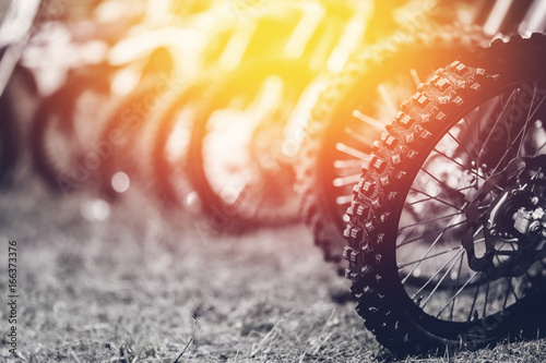 close-up wheel of an off-road motorcycle for a motocross through the mud. copyspace photo