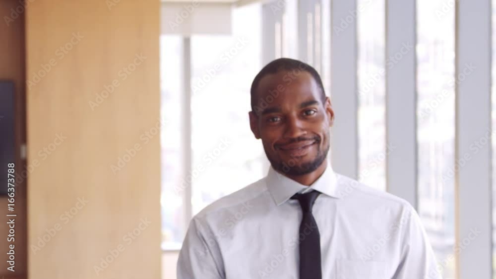 Portrait Of Businessman In Office Walking Towards Camera Portrait Of Businessman In Office Walking Towards Camera