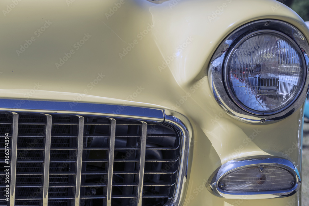 Headlights on a yellow car