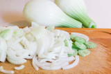 Sliced onion on cutting board. Kitchen table.Closeup photo. Selective focus.