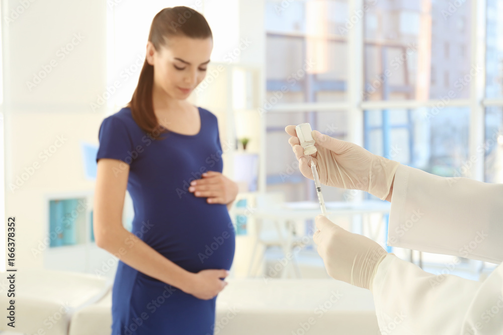 Fototapeta premium Doctor preparing injection for vaccination in clinic