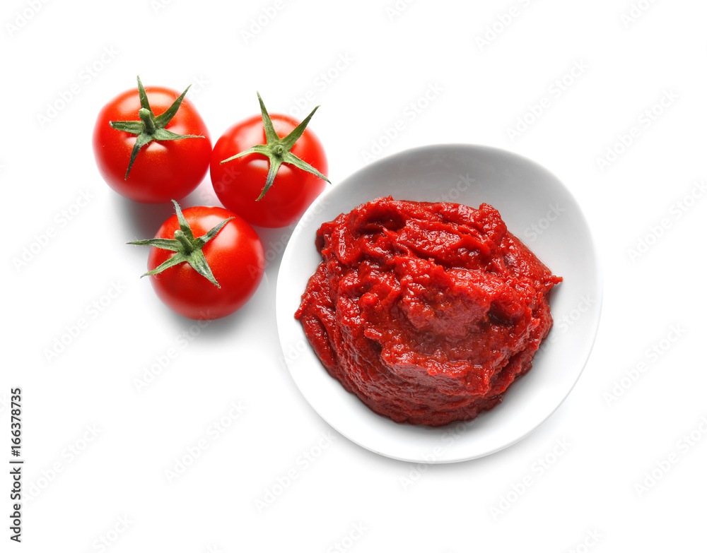 Bowl with sauce and tomatoes on white background Bowl with sauce and tomatoes on white background