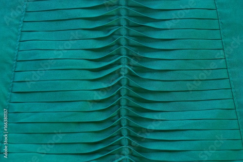 зелёный фон из фрагмента одежды с узором