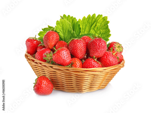 Wicker basket with tasty red strawberries on white background