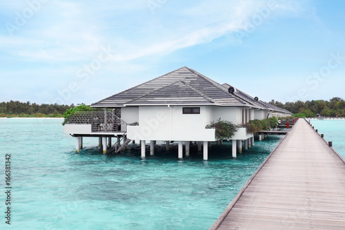 View of modern beach houses on piles at tropical resort © Africa Studio
