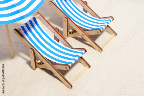 Beach furniture under umbrellas