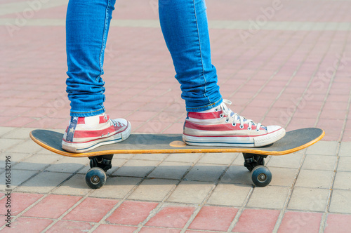 Skateboarder legs closeup