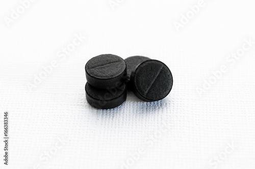 Black tablets on a white background