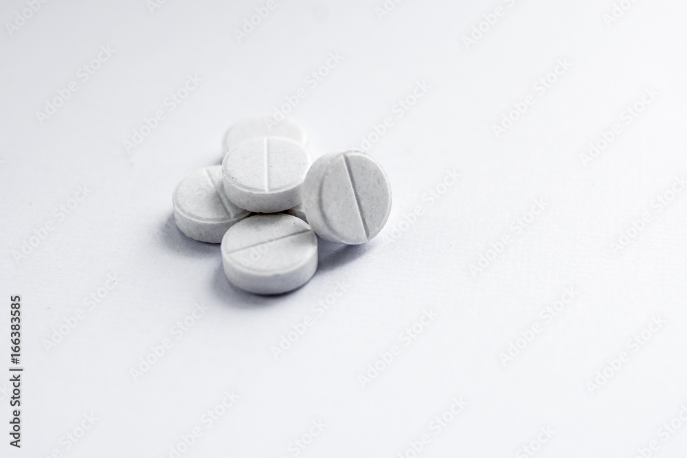 White tablets on a white background White tablets on a white background