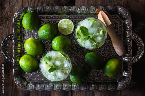 Drinks: making mojito cocktail at home photo