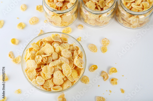 Cornflakes in bowl on a white background