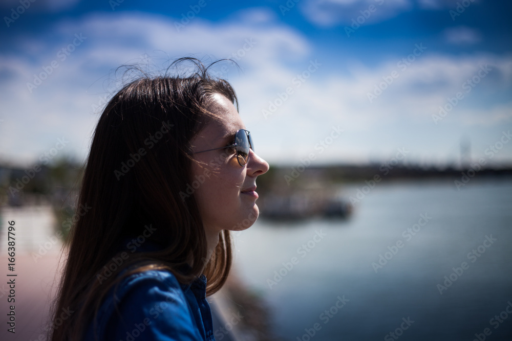 Portrait of a girl in sunglasses near Sava River, Belgrade Waterfront, Serbia