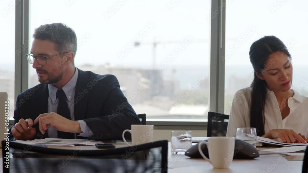 Tracking Shot Of Businesspeople Meeting In Boardroom Tracking Shot Of Businesspeople Meeting In Boardroom