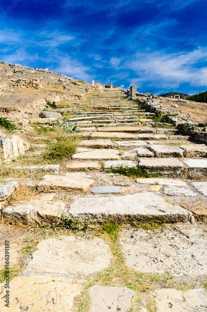 Roman path steps leading up a hill at Hieropolis, Pamakkule, Turkey