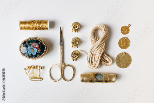 Golden Items Arranged on a White Background