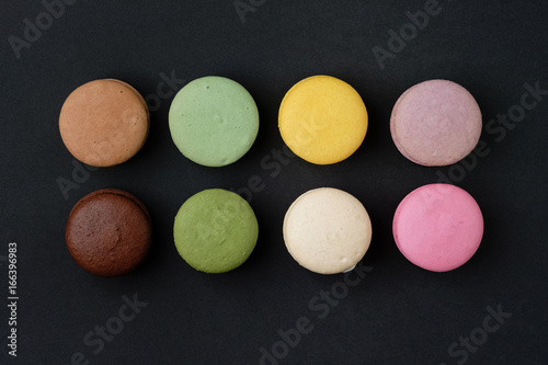 French macaroons on black background