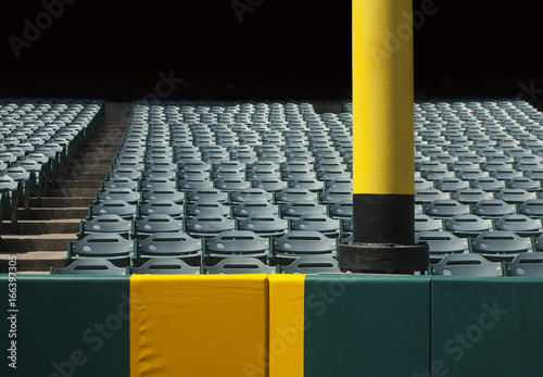 Baseball foul pole with stadium seats

