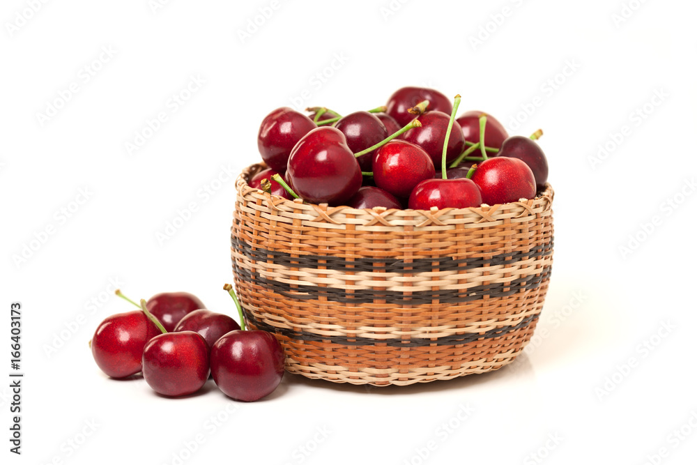 Red Cherries in a basket on white background Red Cherries in a basket on white background