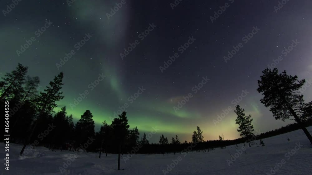 Northern lights above frozen country above arctic in Finland Northern lights above frozen country above arctic in Finland