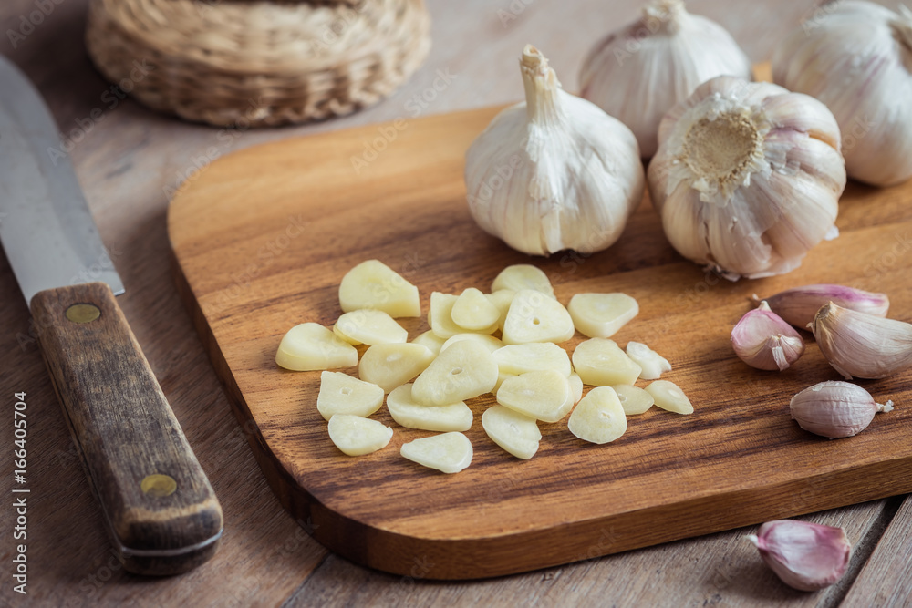 Garlic on wooden cutting board Garlic on wooden cutting board