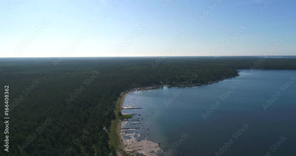 Rocky coast, Cinema 4k aerial landing view over cliffs and rocks on a shore and a beach, in finnish archipelago, on a sunny morning, in Padva, Uusimaa, Finland Rocky coast, Cinema 4k aerial landing view over cliffs and rocks on a shore and a beach, in finnish archipelago, on a sunny morning, in Padva, Uusimaa, Finland