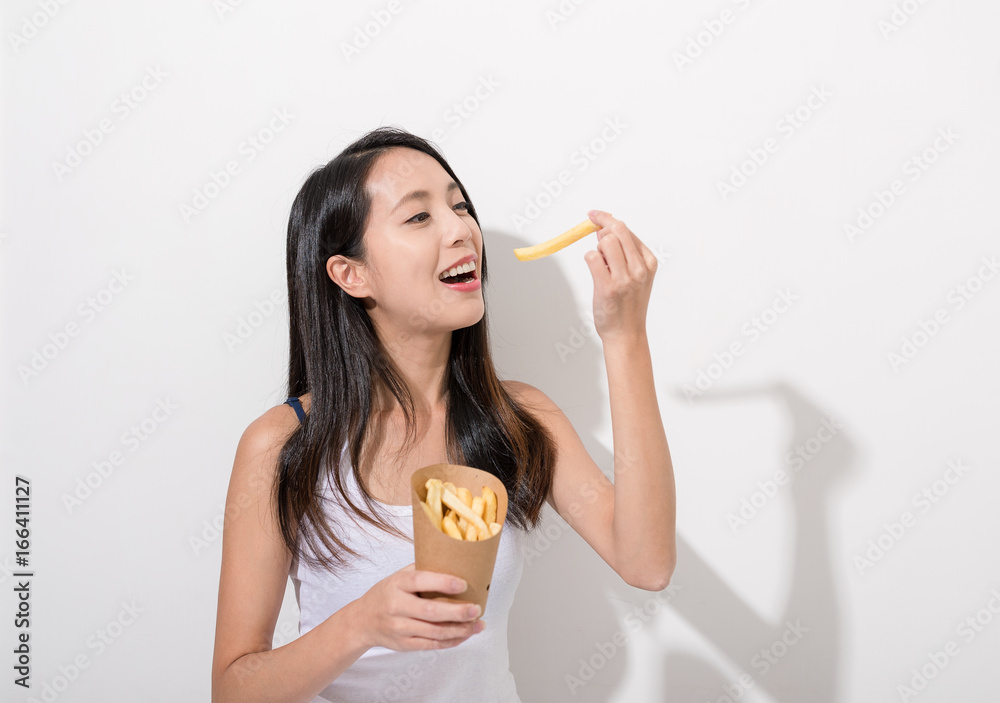 Woman enjoy french fries
