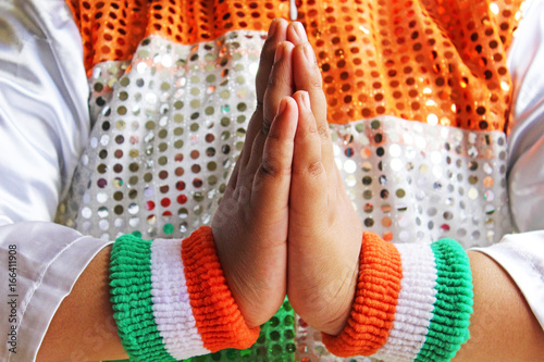 kid wearing Indian tricolor jacket and wrist band, celebrating Indian national festival