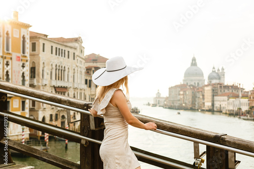 Girl in a hat walks at dawn in venice © Angelov