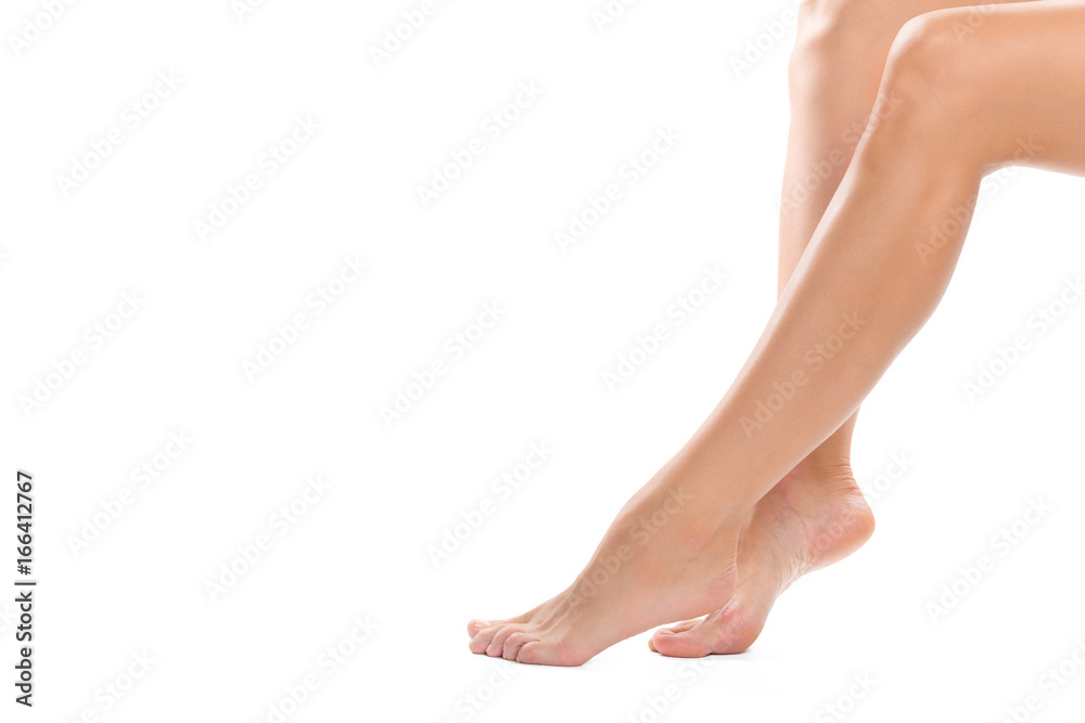 Beautiful women feet isolated on white close-up Beautiful women feet isolated on white close-up