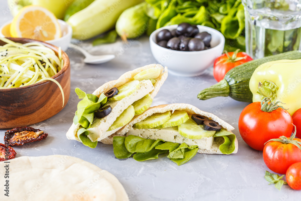 Healthy sandwiches with vegetables and tofu in pita. Healthy sandwiches with vegetables and tofu in pita.