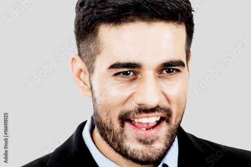 Portrait of handsome man on gray background