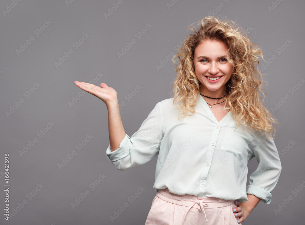 Stylish model gesturing on gray Stylish model gesturing on gray
