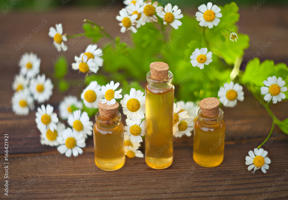 Essence of flowers on table in beautiful glass jar Essence of flowers on table in beautiful glass jar