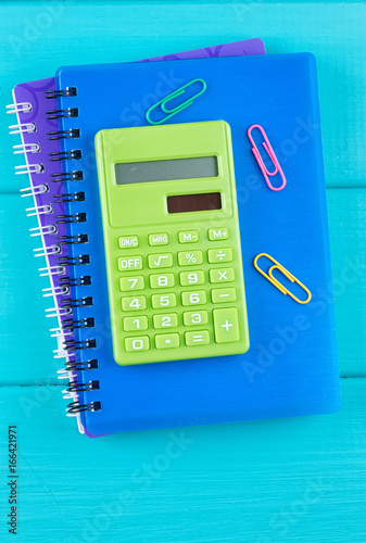 Notepad, calculator and other stationery tools photo