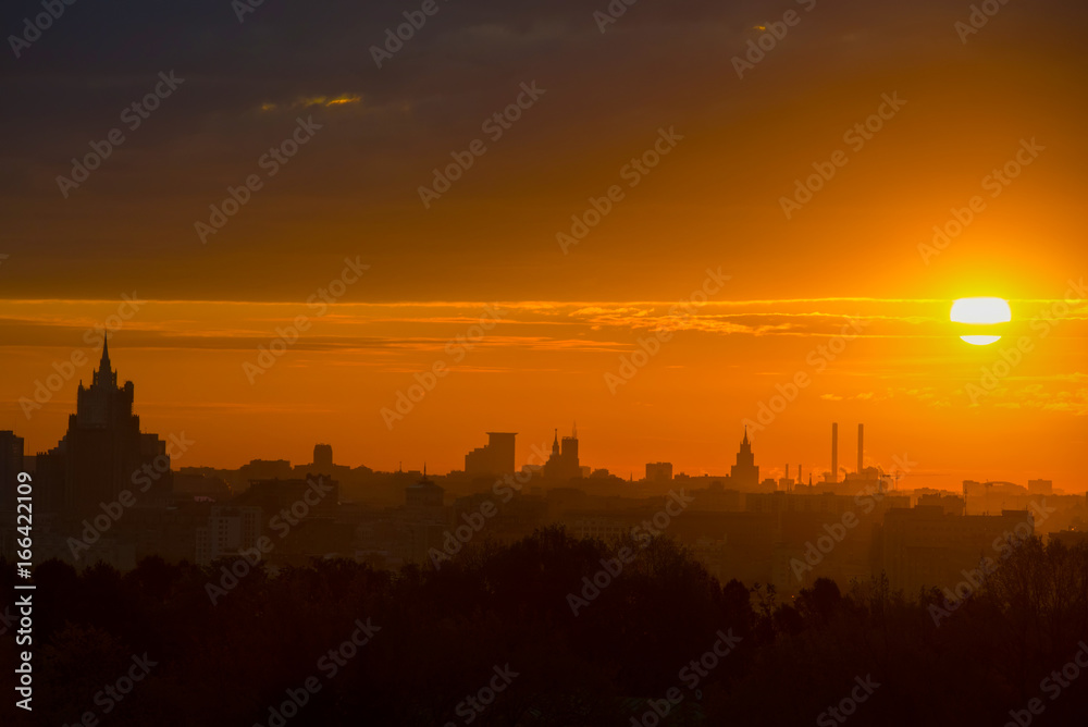 The sun rises above the horizon in Moscow